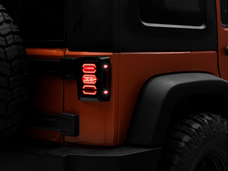 Raxiom 07-18 Jeep Wrangler JK LED Tail Lights- Black Housing (Smoked Lens) Tail Lights Raxiom