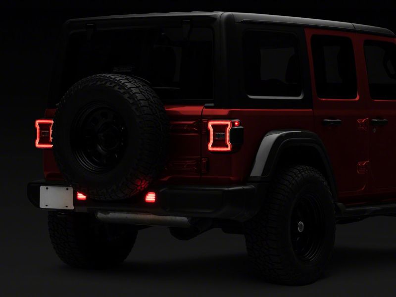 Raxiom 18-23 Jeep Wrangler JL Moab Rubicon Sahara Axial LED Rear Bumper Reflector Lights- Clear Light Bars & Cubes Raxiom