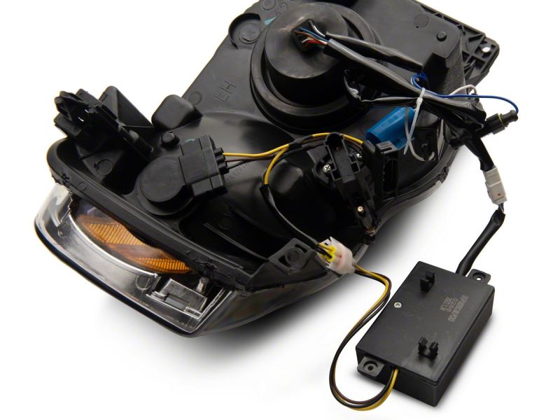 Raxiom 02-05 Dodge RAM 1500 LED Projector Headlights w/ SEQL LED Bar- Blk Housing (Clear Lens) Headlights Raxiom