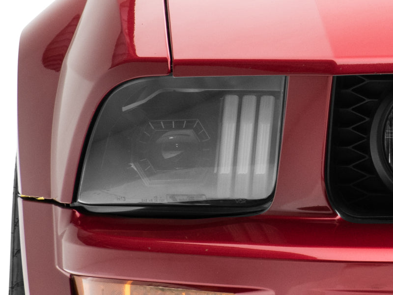 Raxiom 05-09 Ford Mustang w/ Halogen Prjctor Headlights- Black Housing (Clear Lens) (No GT500 ) Headlights Raxiom