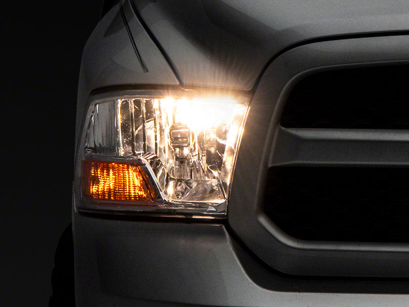 Raxiom 09-18 Dodge RAM 1500 Axial OEM Rep Headlights w/ Single Bulb- Chrome Housing (Clear Lens) Headlights Raxiom