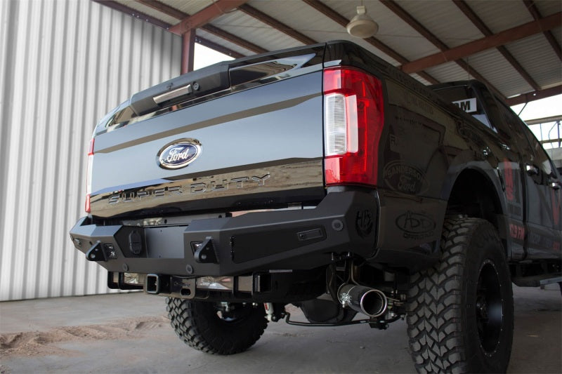 Addictive Desert Designs 17-18 Ford F-250 HoneyBadger Rear Bumper w/ Backup Sensor Cutouts Bumpers - Steel Addictive Desert Designs
