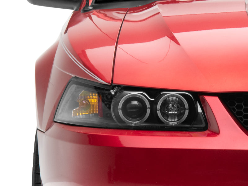 Raxiom 99-04 Ford Mustang Dual LED Halo Projector Headlights- Black Housing (Clear Lens) Headlights Raxiom