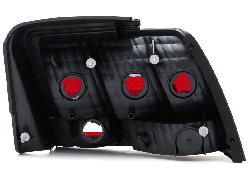 Raxiom 99-04 Ford Mustang Excluding 99-01 Cobra Tail Lights- Black Housing (Smoked Lens) Tail Lights Raxiom