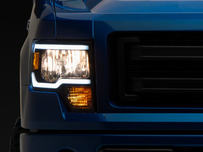 Raxiom 09-14 Ford F-150 Axial Series Headlights w/ LED Bar- Blk Housing (Clear Lens) Headlights Raxiom