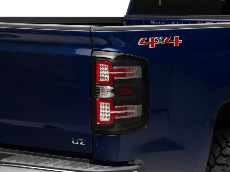 Raxiom 14-18 Chevrolet Silverado 1500 LED Taillights w/ SEQL Turn Signals- Blk Housing (Clear Lens) Lights Corner Raxiom