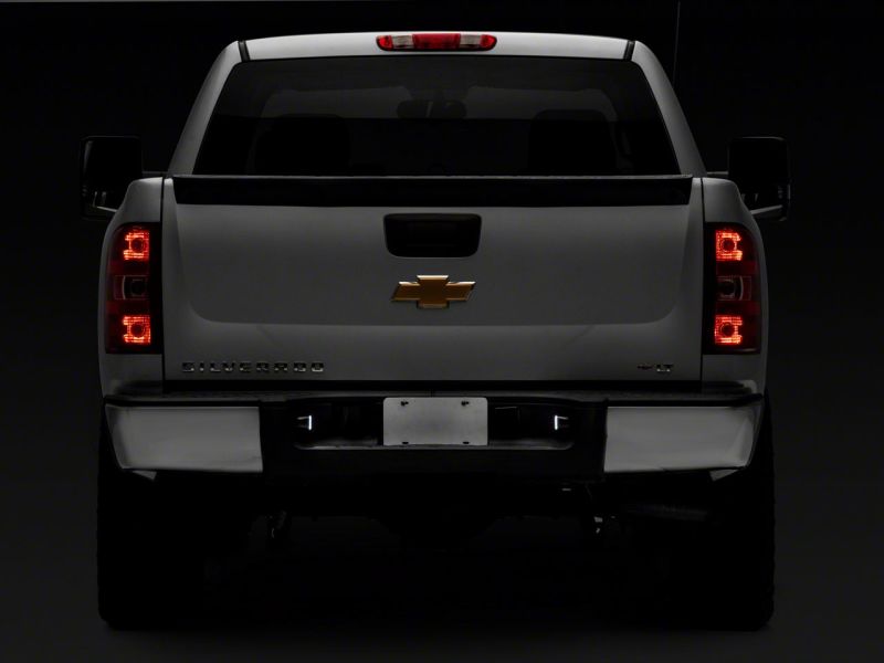 Raxiom 01-13 Chevrolet Silverado/GMC Sierra 1500 Axial Series LED License Plate Lamps- Smoked Bulbs Raxiom