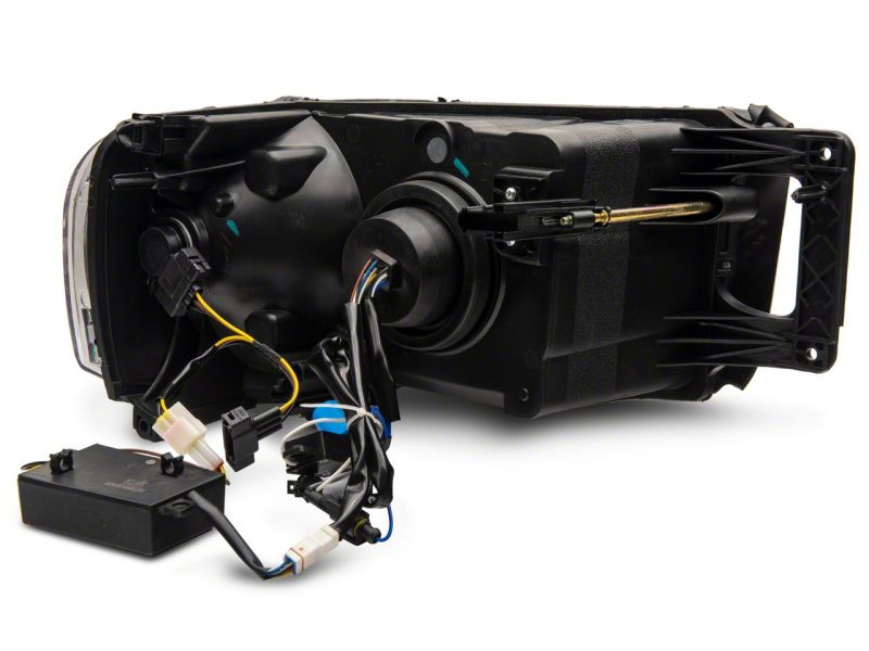 Raxiom 02-05 Dodge RAM 1500 LED Projector Headlights w/ SEQL LED Bar- Blk Housing (Clear Lens) Headlights Raxiom