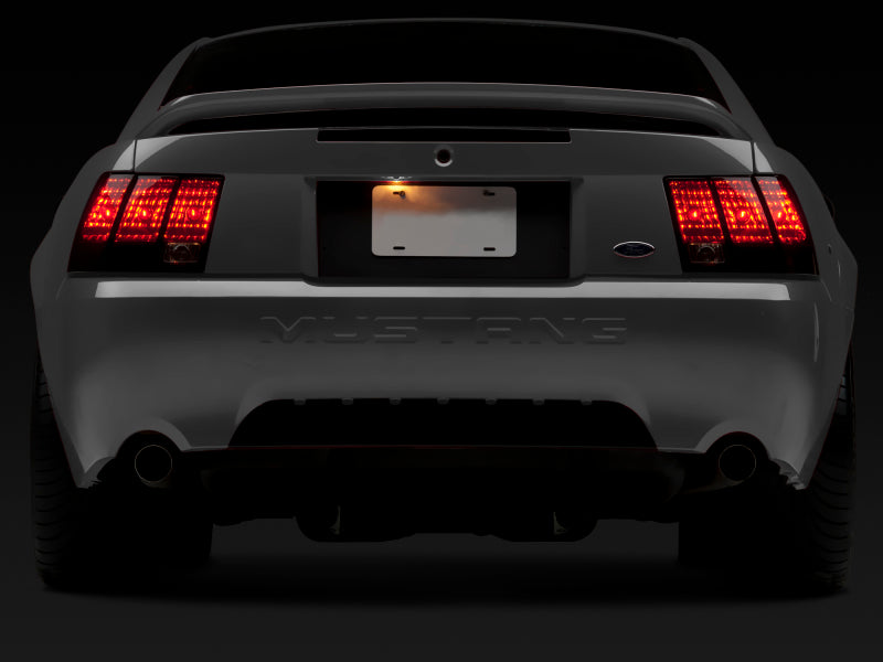 Raxiom 99-04 Ford Mustang Excluding 99-01 Cobra Tail Lights- Black Housing (Smoked Lens) Tail Lights Raxiom