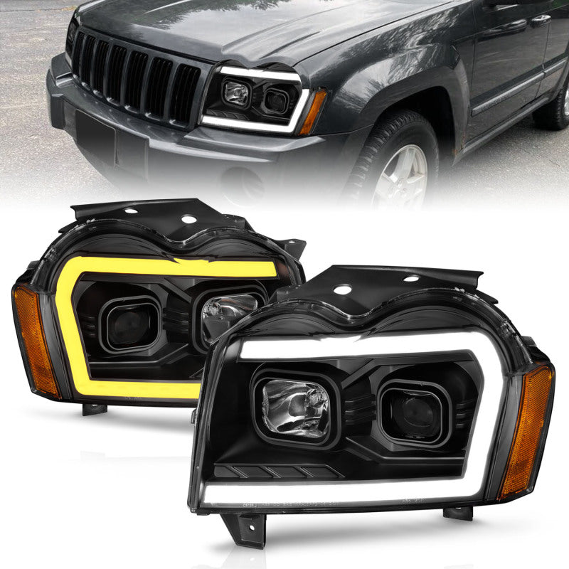 ANZO 2005-2007 Jeep Grand Cherokee Projector Headlights w/ Light Bar Switchback Black Housing Headlights ANZO