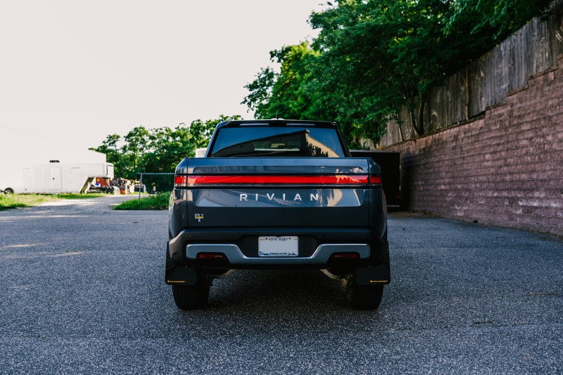 Rally Armor 22-25 Rivian R1T Black UR Mud Flap w/Tangerine Scream Logo Mud Flaps Rally Armor