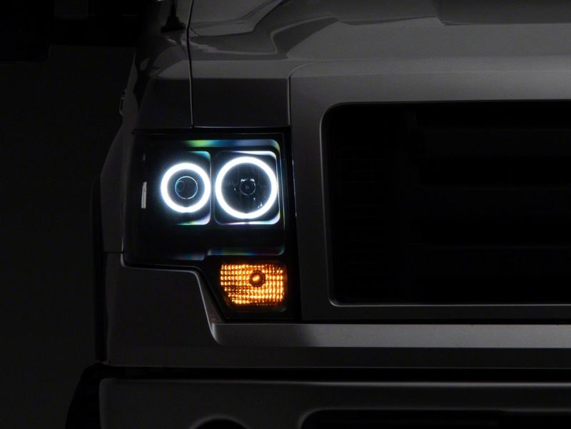 Raxiom 09-14 Ford F-150 Super White LED Halo Projector Headlights- Black Housing (Clear Lens) Headlights Raxiom