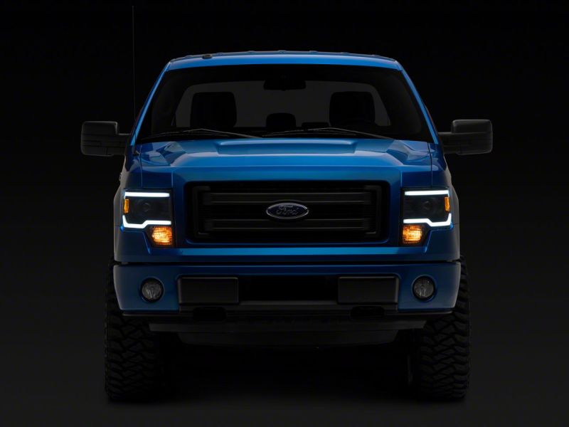 Raxiom 09-14 Ford F-150 Axial Series Projector Headlights w/ LED Light Bar- Blk Housing (Clear Lens) Headlights Raxiom