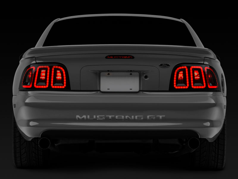 Raxiom 96-98 Ford Mustang Icon LED Tail Lights- Black Housing (Smoked Lens) Tail Lights Raxiom