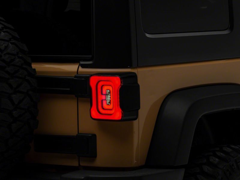 Raxiom 07-18 Jeep Wrangler JK Axial Series LED Tail Lights- Blk Housing (Smoked Lens) Tail Lights Raxiom