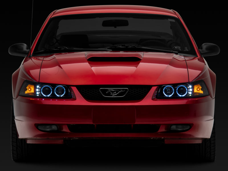 Raxiom 99-04 Ford Mustang Dual LED Halo Projector Headlights- Black Housing (Clear Lens) Headlights Raxiom