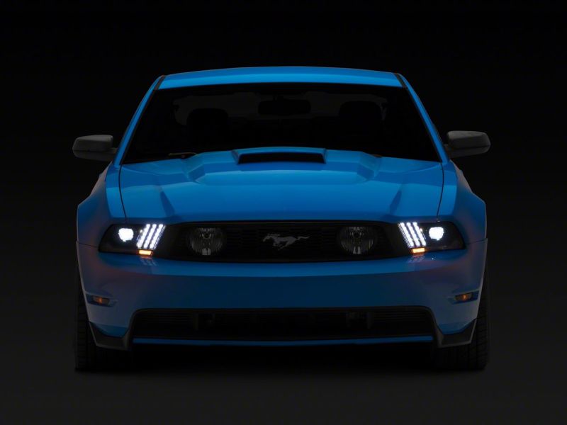 Raxiom 10-12 Ford Mustang LED Projector Headlights SEQL Turn Signals- Blk Housing (Clear Lens) Headlights Raxiom