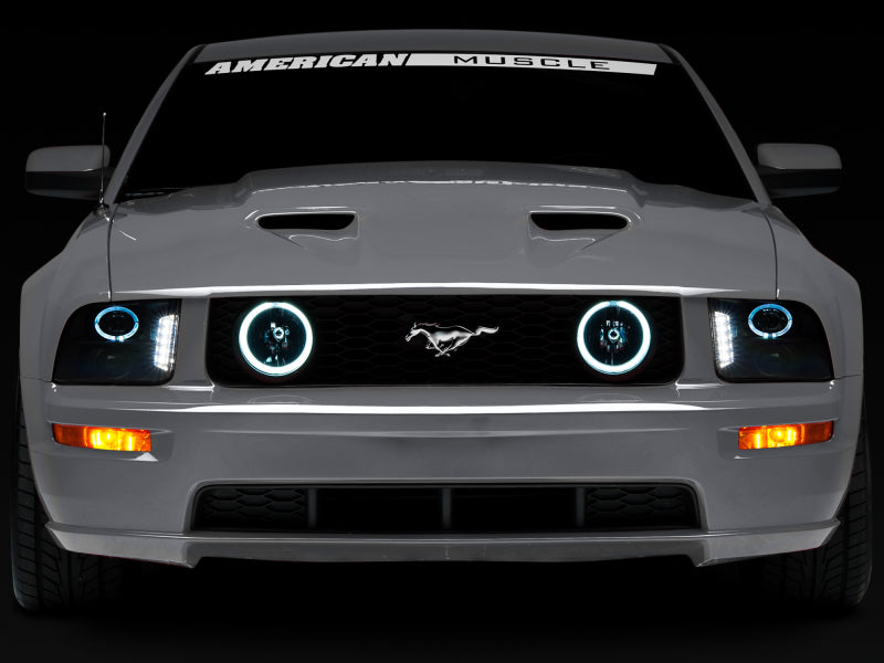 Raxiom 05-09 Ford Mustang w/ Halogen LED Halo Prjctr Headlights-Blk Hsng(Smoked Lens Exclude GT500) Headlights Raxiom