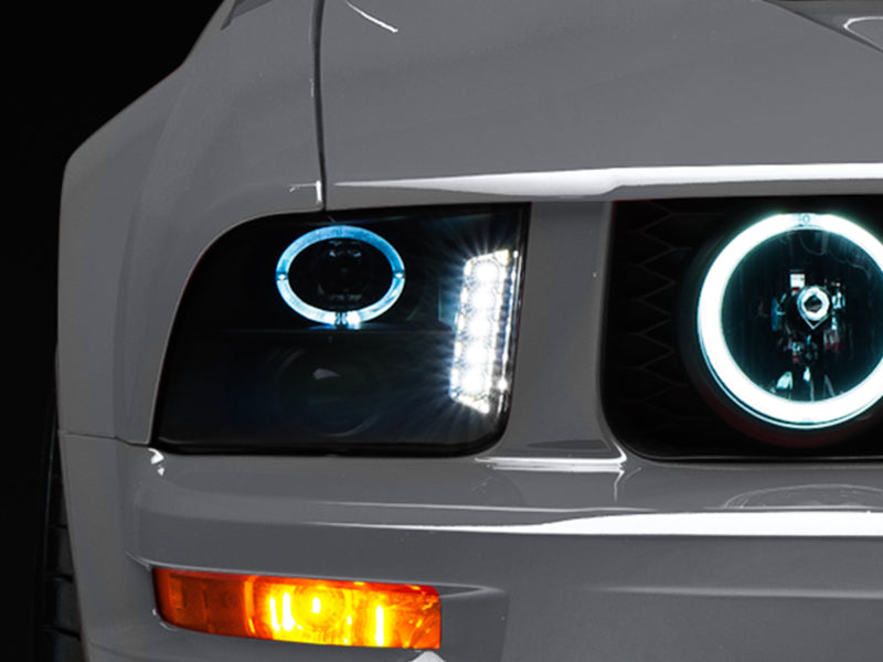Raxiom 05-09 Ford Mustang w/ Halogen LED Halo Prjctr Headlights-Blk Hsng(Smoked Lens Exclude GT500) Headlights Raxiom