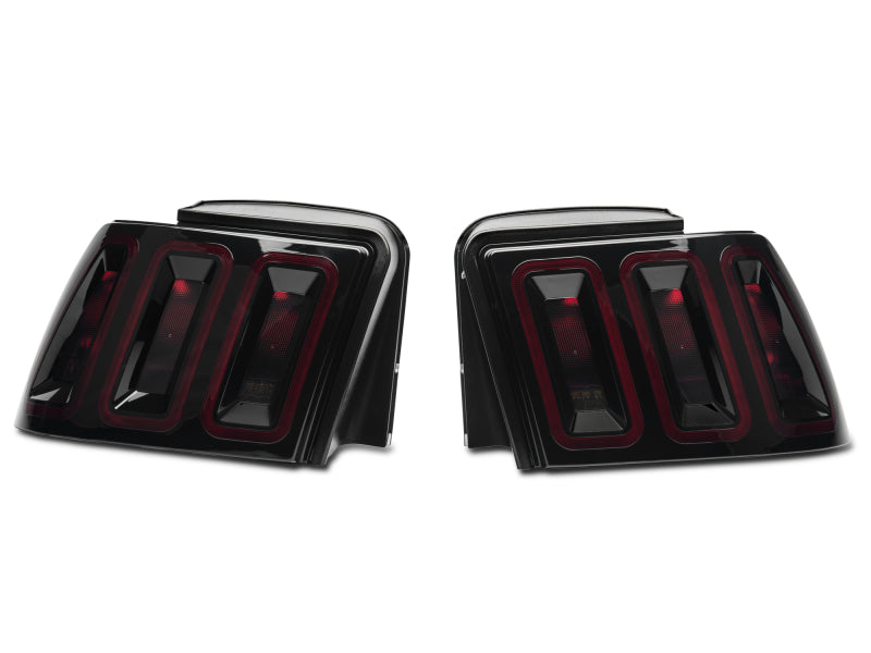 Raxiom 99-04 Ford Mustang Excluding 99-01 Cobra Icon LED Tail Lights- Black Housing (Smoked Lens) Tail Lights Raxiom