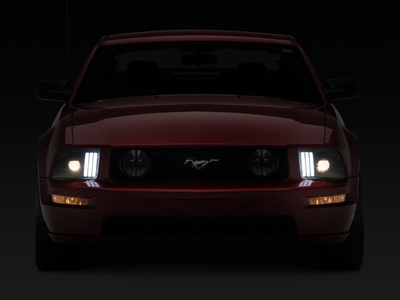 Raxiom 05-09 Ford Mustang w/ Halogen Prjctor Headlights- Black Housing (Clear Lens) (No GT500 ) Headlights Raxiom