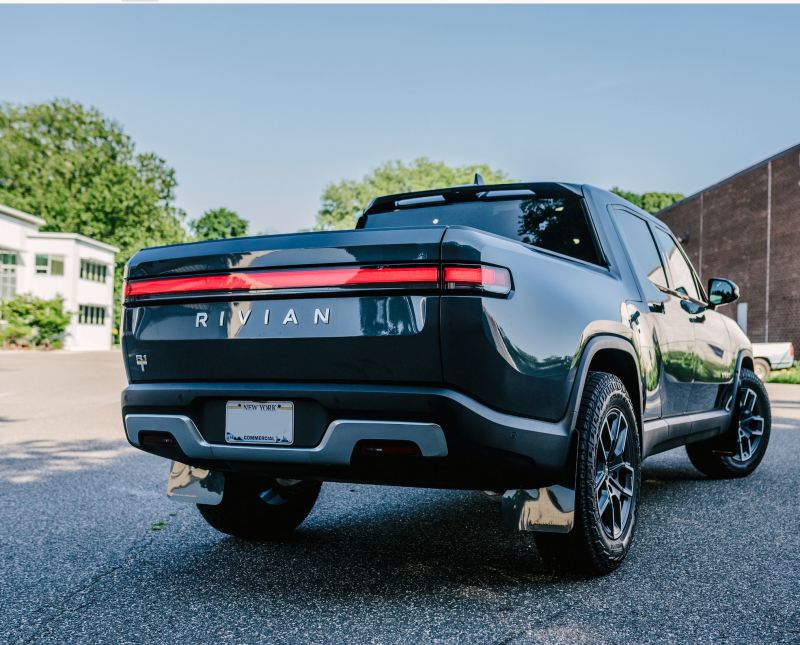Rally Armor 22-25 Rivian R1T Black UR Mud Flap w/Tangerine Scream Logo Mud Flaps Rally Armor