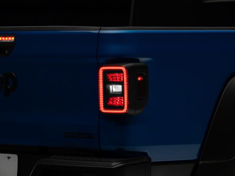 Raxiom 20-23 Jeep Gladiator JT LED Tail Lights- Blk Housing (Smoked Lens) Tail Lights Raxiom