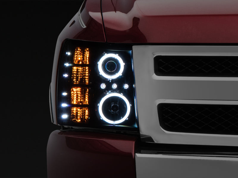 Raxiom 07-13 Silverado 1500 Super White LED Halo Projector Headlights- Black Housing (Clear Lens) Headlights Raxiom