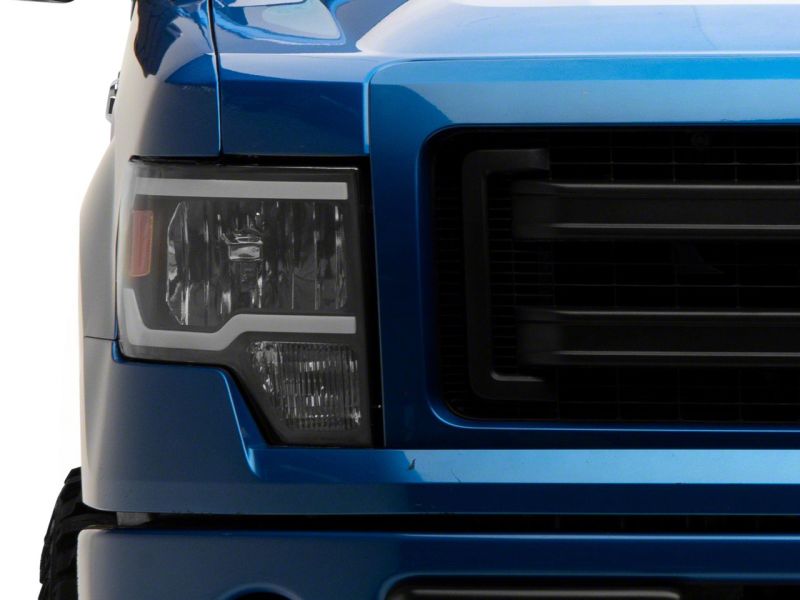 Raxiom 09-14 Ford F-150 Axial Series Headlights w/ LED Bar- Blk Housing (Clear Lens) Headlights Raxiom