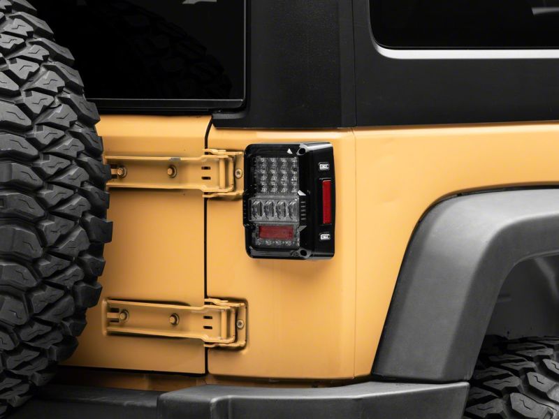 Raxiom 07-18 Jeep Wrangler JK Axial Series Lux LED Tail Lights- Blk Housing (Clear Lens) Tail Lights Raxiom