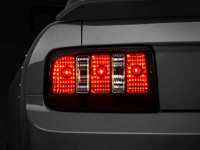 Raxiom 05-09 Ford Mustang Coyote Tail Lights- Blk Housing (Smoked Lens) Tail Lights Raxiom