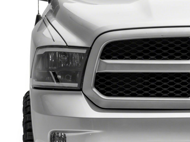 Raxiom 09-18 Dodge RAM 1500/2500/3500 Axial Series Headlights w/ LED Bar- Black Housing (Clear Lens) Headlights Raxiom