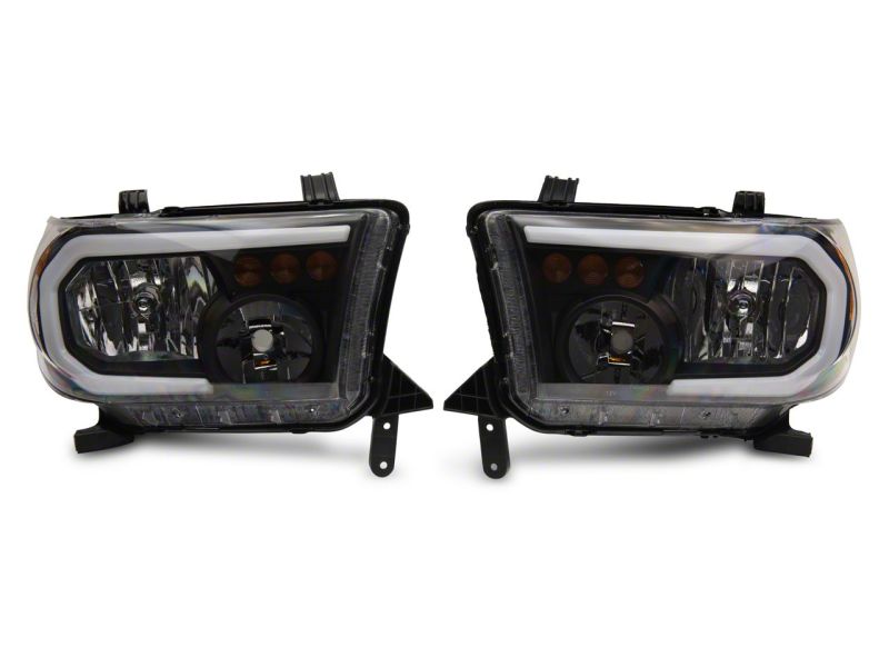 Raxiom 07-13 Toyota Tundra Axial Series Headlights w/ LED Bar- Blk Housing (Clear Lens) Headlights Raxiom