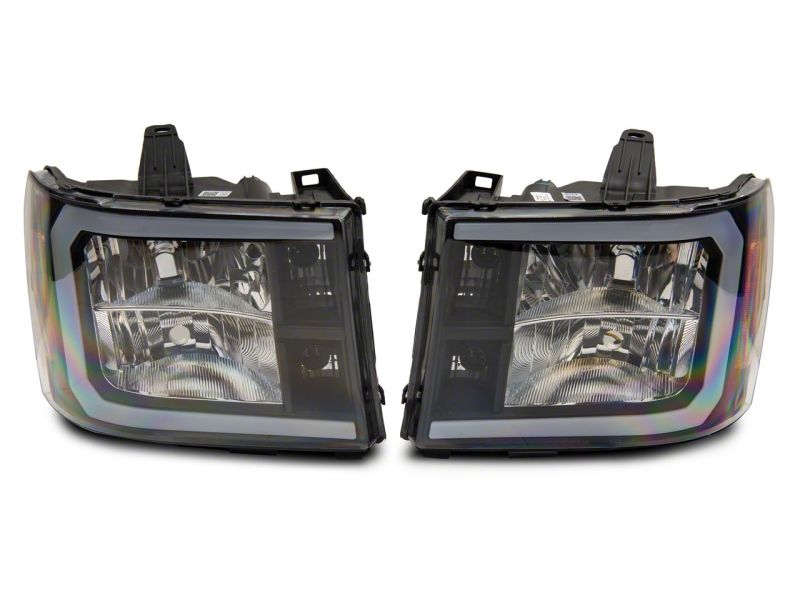 Raxiom 07-13 GMC Sierra 1500 Axial Series Headlights w/ LED Bar- Black Housing (Clear Lens) Headlights Raxiom