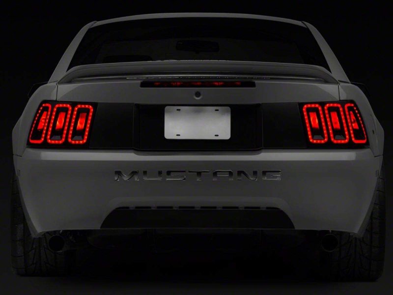 Raxiom 99-04 Ford Mustang Excluding 99-01 Cobra Icon LED Tail Lights- Black Housing (Smoked Lens) Tail Lights Raxiom
