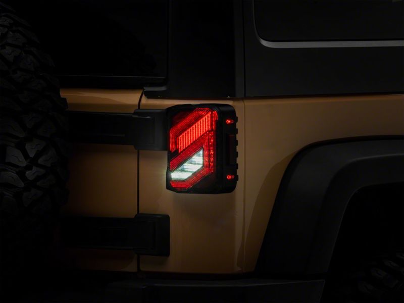 Raxiom 07-18 Jeep Wrangler JK Axial Series Trident LED Tail Lights- Blk Housing (Clear Lens) Tail Lights Raxiom