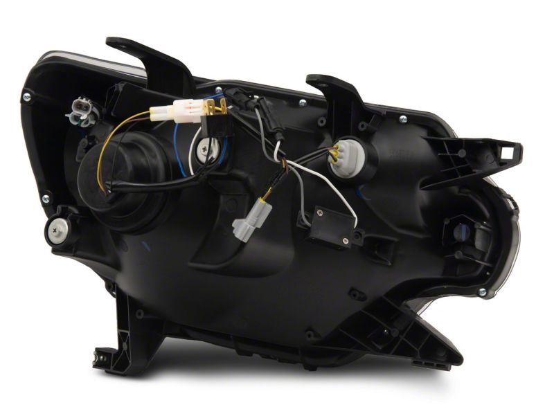 Raxiom 12-15 Toyota Tacoma Axial Projector Headlights w/ SEQL LED Bar- Black Housing (Clear Lens) Headlights Raxiom