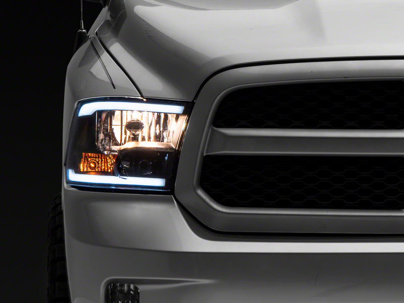 Raxiom 09-18 Dodge RAM 1500/2500/3500 Axial Series Headlights w/ LED Bar- Black Housing (Clear Lens) Headlights Raxiom
