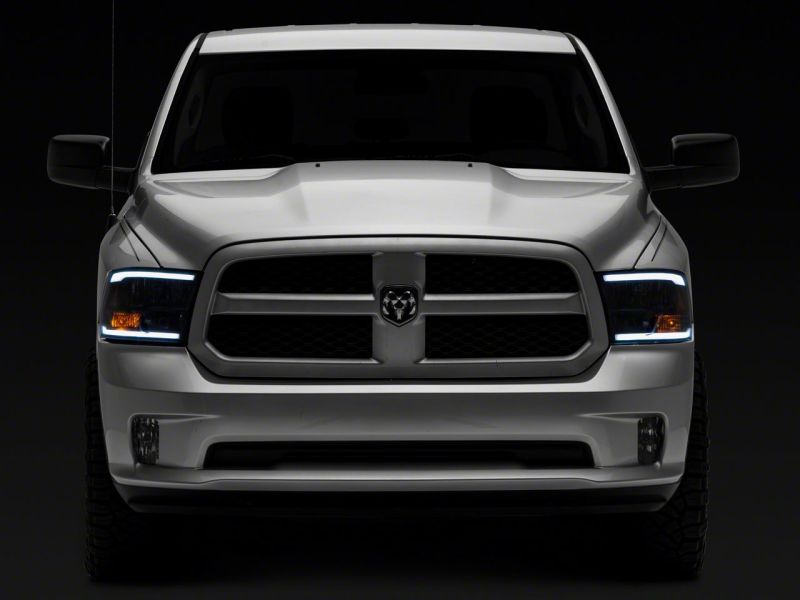 Raxiom 09-18 Dodge RAM 1500/2500/3500 Axial Series Headlights w/ LED Bar- Black Housing (Clear Lens) Headlights Raxiom