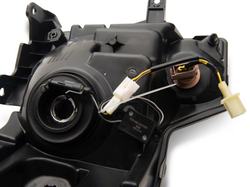 Raxiom 09-14 Ford F-150 Axial Series Headlights w/ LED Bar- Blk Housing (Clear Lens) Headlights Raxiom