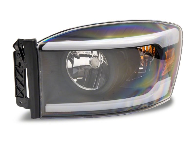 Raxiom 06-09 Dodge RAM 1500/2500/3500 Axial Headlights w/ SEQL LED Bar- Blk Housing (Clear Lens) Headlights Raxiom
