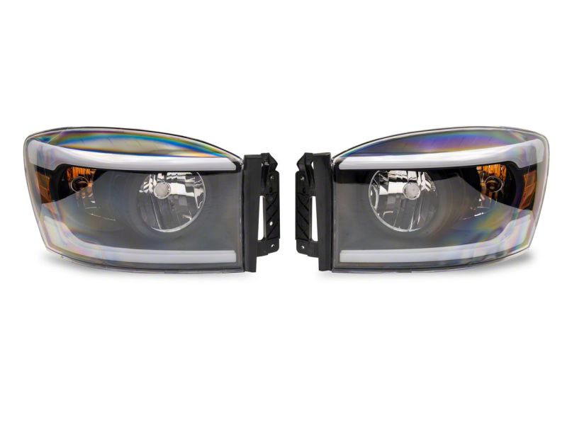 Raxiom 06-09 Dodge RAM 1500/2500/3500 Axial Headlights w/ SEQL LED Bar- Blk Housing (Clear Lens) Headlights Raxiom