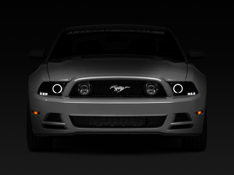 Raxiom 13-14 Ford Mustang w/ Factory HIDLED Halo Projector Headlights- Black Housing (Smoked Lens) Headlights Raxiom