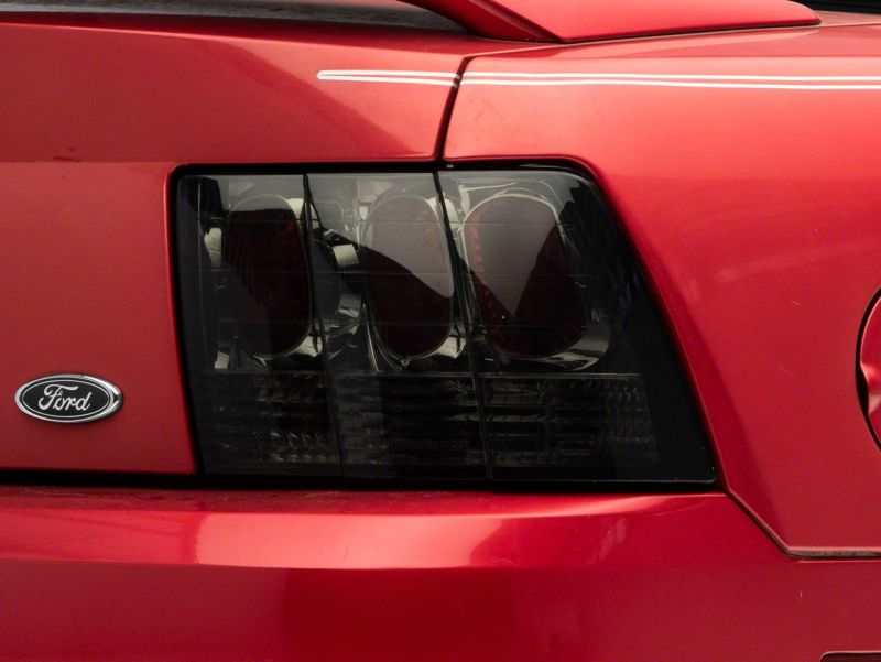 Raxiom 99-04 Ford Mustang Axial Series Altezza Style Tail Lights- Blk Housing (Smoked Lens) Tail Lights Raxiom