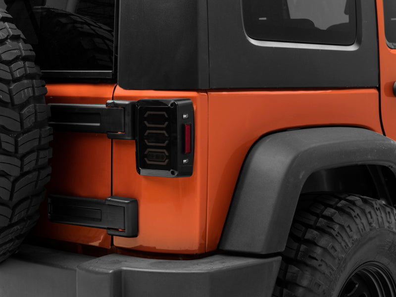 Raxiom 07-18 Jeep Wrangler JK LED Tail Lights- Black Housing (Smoked Lens) Tail Lights Raxiom