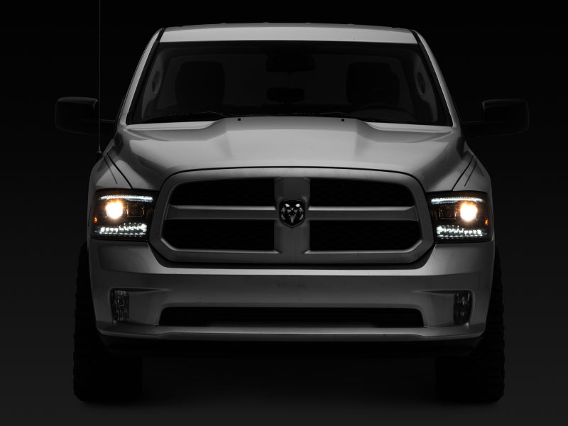 Raxiom 09-18 RAM 1500 LED Projector Headlights w/ Switchback Turn Signals- Blk Housing (Clear Lens) Headlights Raxiom