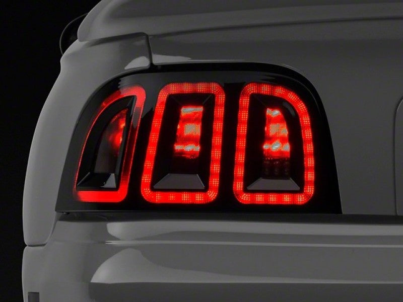 Raxiom 96-98 Ford Mustang Icon LED Tail Lights- Black Housing (Smoked Lens) Tail Lights Raxiom