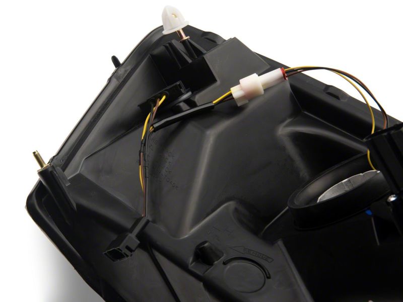 Raxiom 06-09 Dodge RAM 1500/2500/3500 Axial Headlights w/ SEQL LED Bar- Blk Housing (Clear Lens) Headlights Raxiom