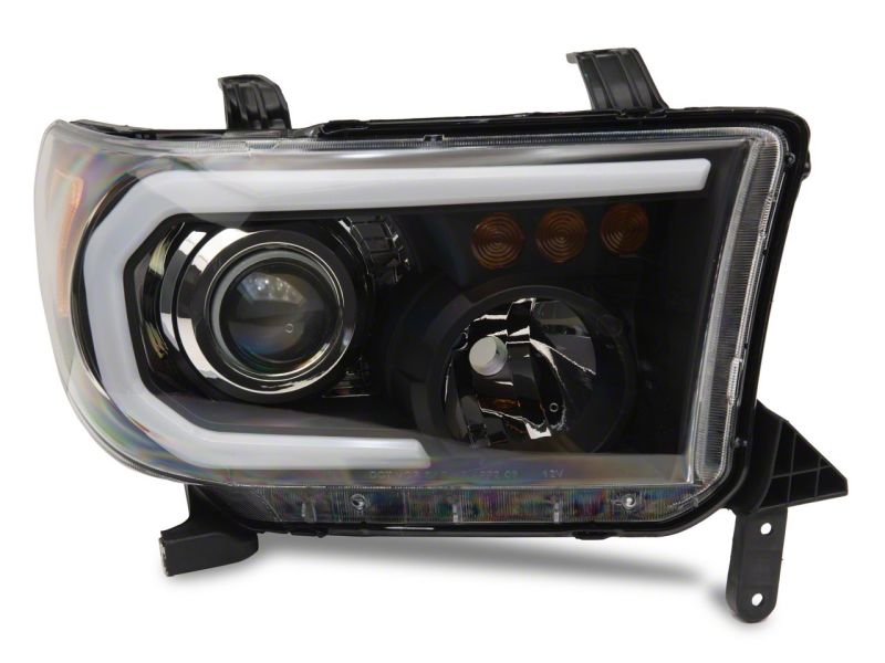 Raxiom 07-13 Toyota Tundra Axial Projector Headlights w/ SEQL LED Bar- Black Housing (Clear Lens) Headlights Raxiom