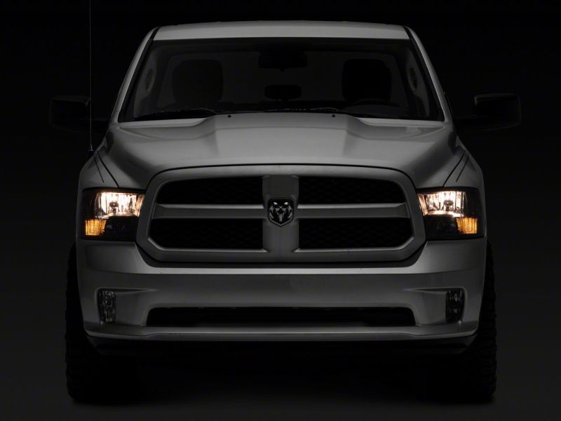 Raxiom 09-18 Dodge RAM 1500 Axial Series Euro Style Headlights w/ Dual Bulb Blk Housing (Clear Lens) Headlights Raxiom
